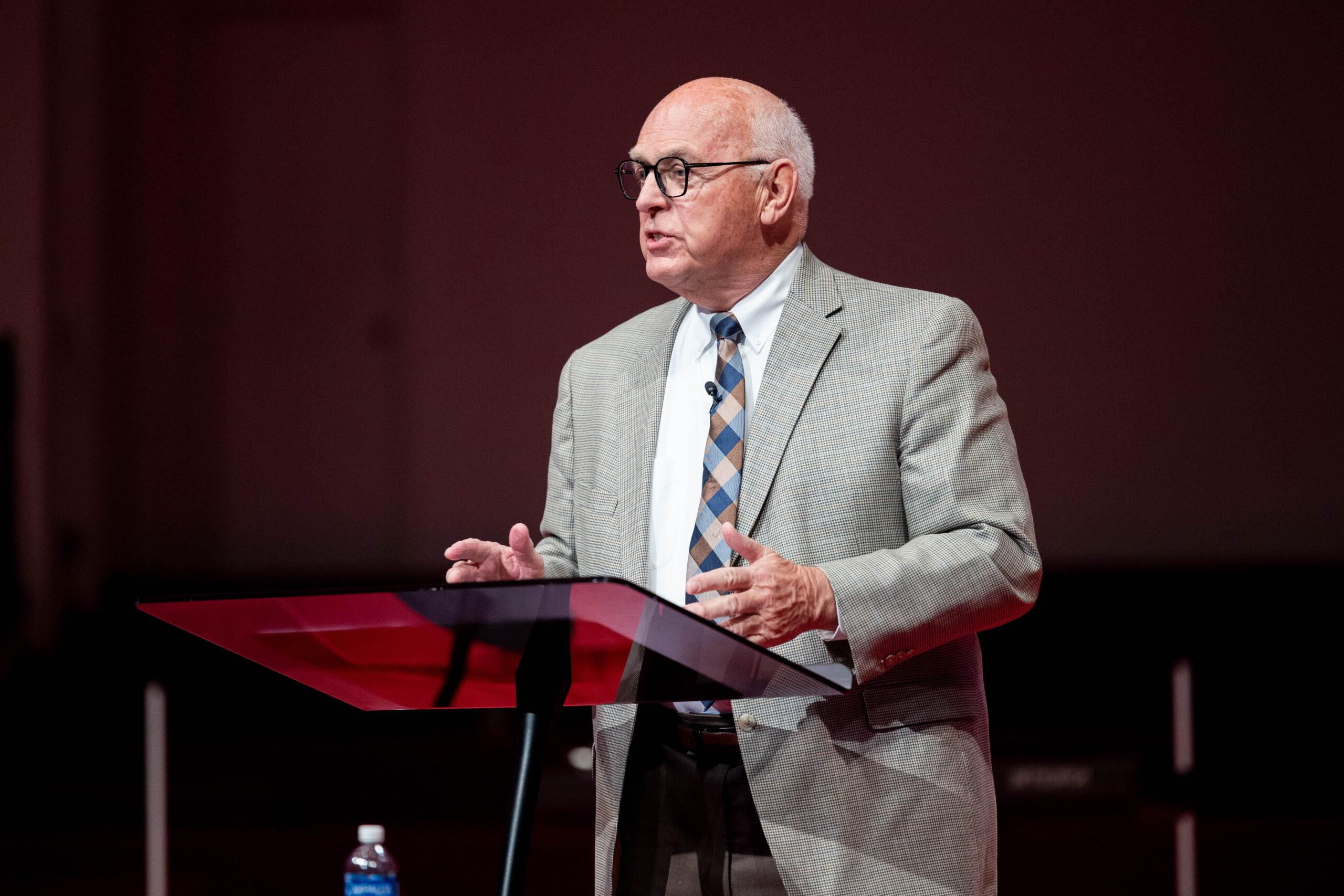 MNU president Dr. David J. Spittal speaking on stage at the 30 year recognition chapel in 2024